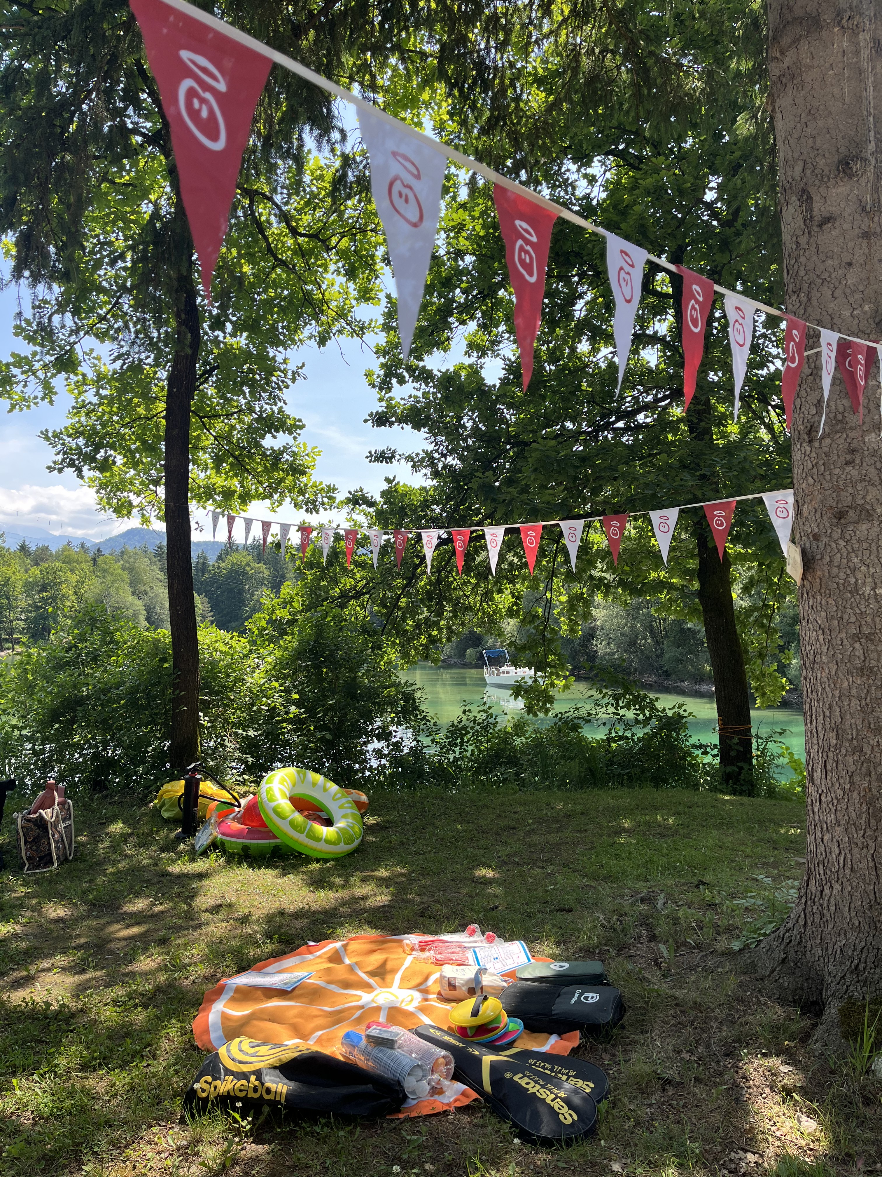 Picnic setup with decorations, near a river.